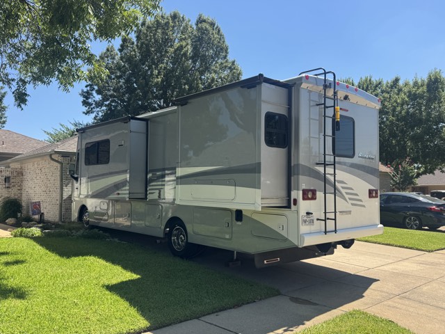 Rear three-quarter — slides & rear ladder