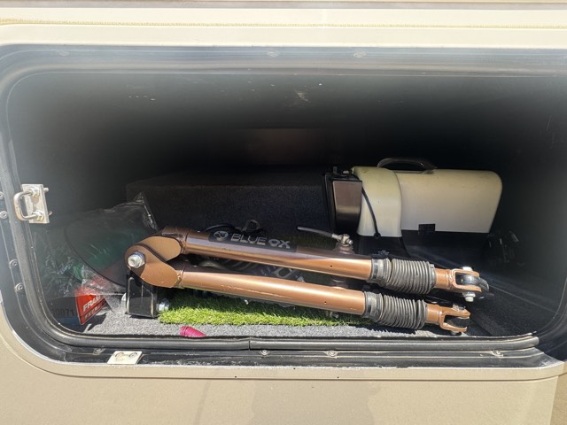 Pass-through storage bay