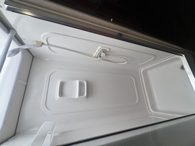 Drop-down bunk over cab